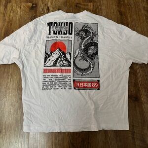 white graphic tee with black and red print